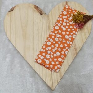 Tecido tricoline estampado margaridas fundo laranja